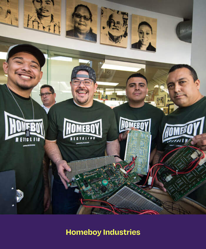 People holding e-waste at Homeboy Industries recycling center